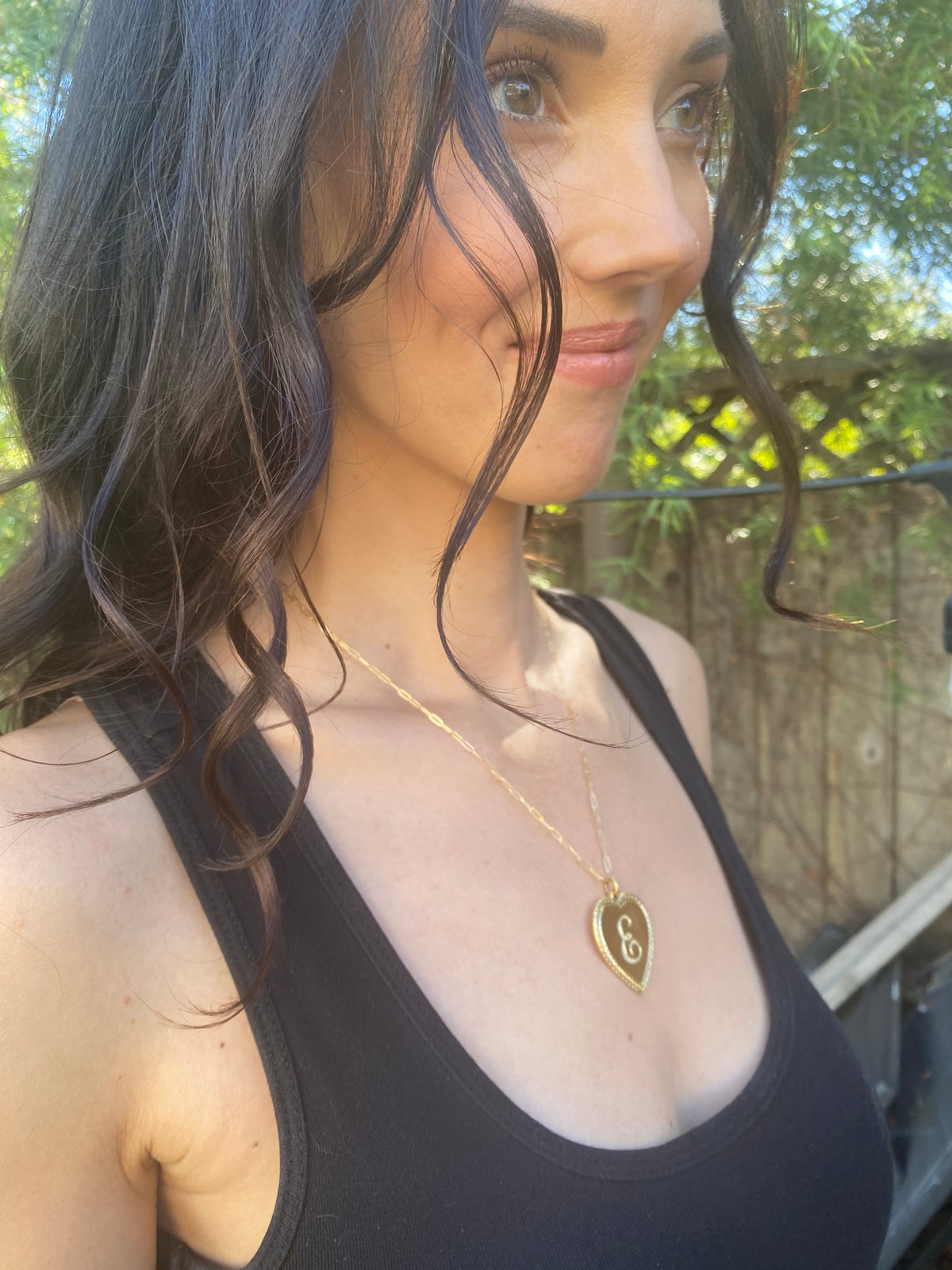 Woman wearing Ribbed Heart Necklace