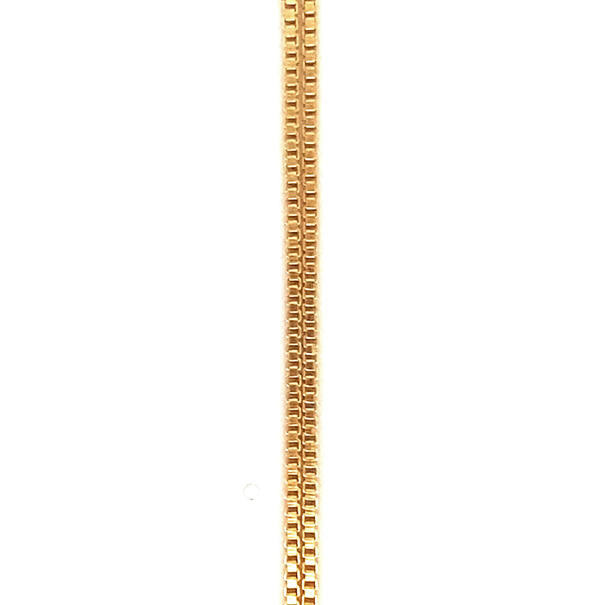 Extreme close-up detail of a gold box chain necklace showing the interlocking square link pattern against a white background