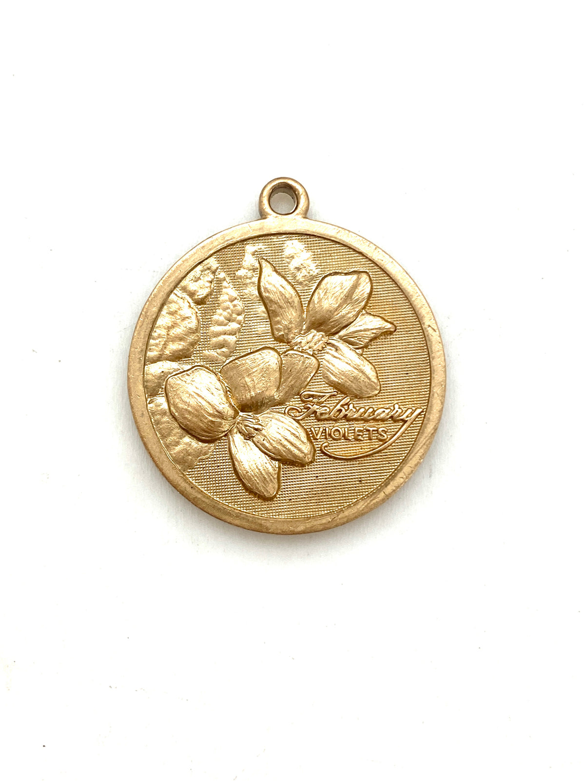 Gold embossed February violet birth month flower coin pendant charm on a white background