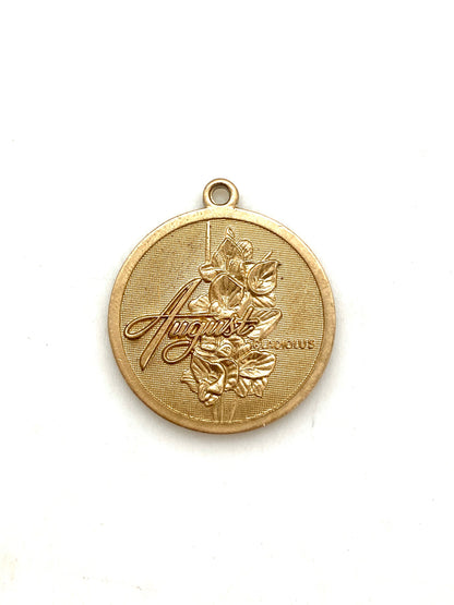 Gold embossed August gladiolus birth month flower coin pendant charm on a white background