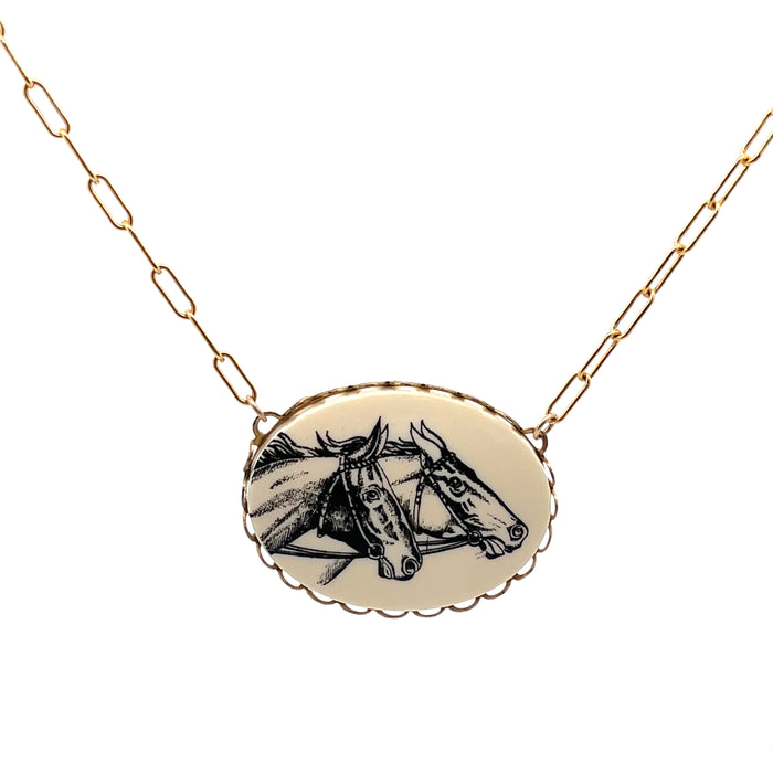 Necklace with a pendant featuring two horses on a beige background
