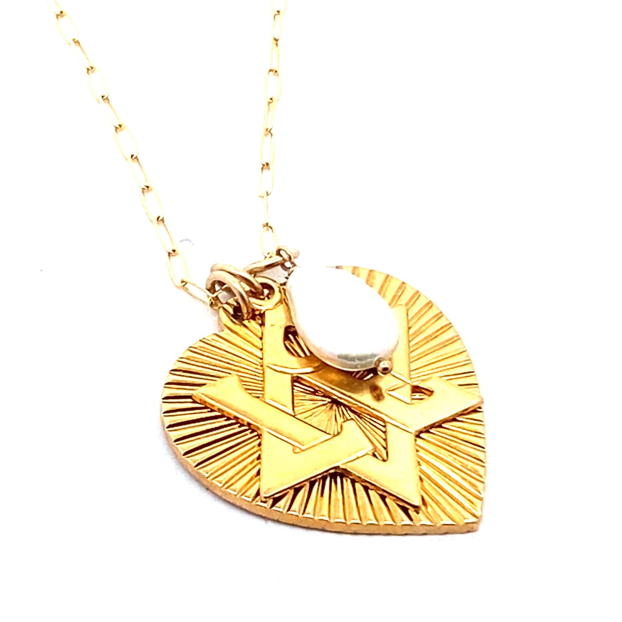 A gold-plated necklace featuring a ribbed heart with a Star of David charm and a large freshwater pearl pendant, displayed on a person's neck.