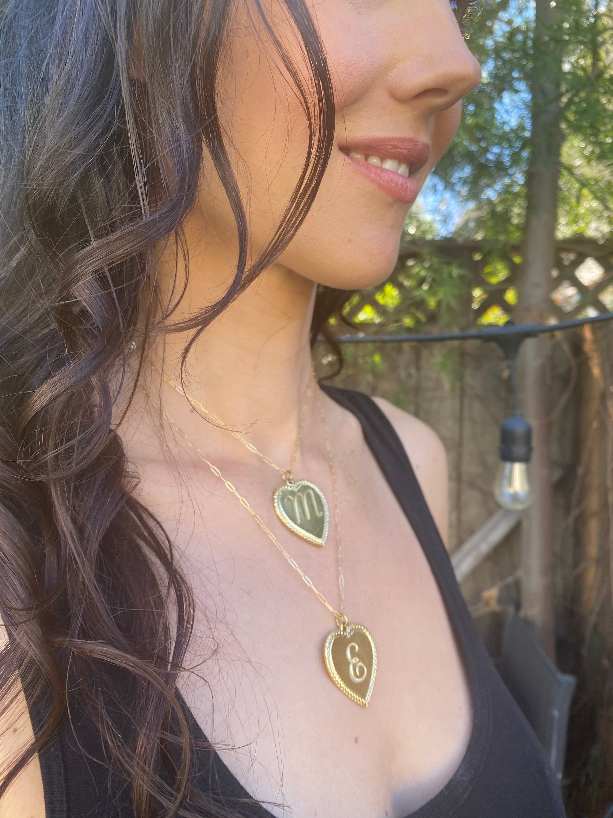 Woman wearing Ribbed Heart Necklace
