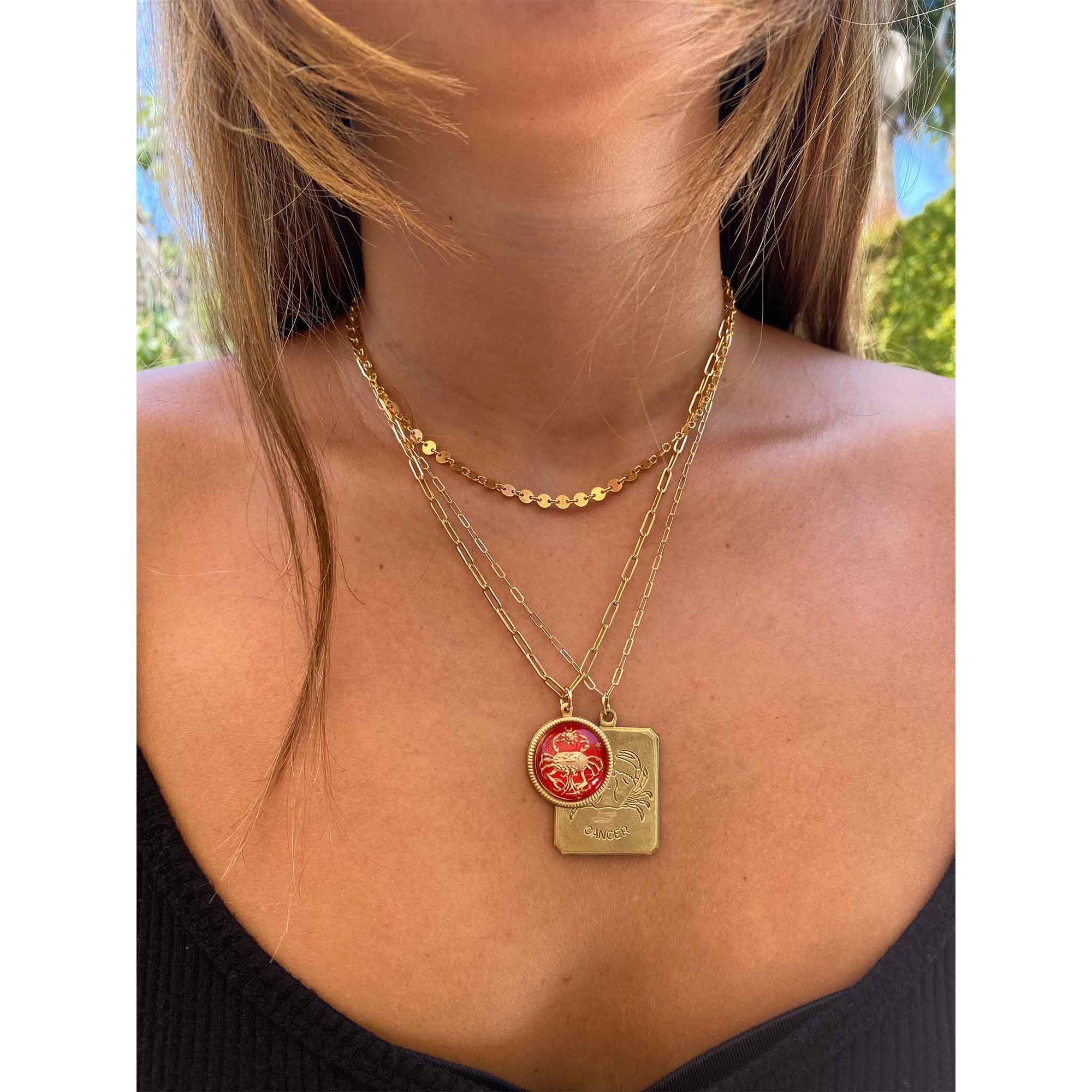lifestyle image woman wearing a gold necklace with a virgo vintage brass rectangle charm