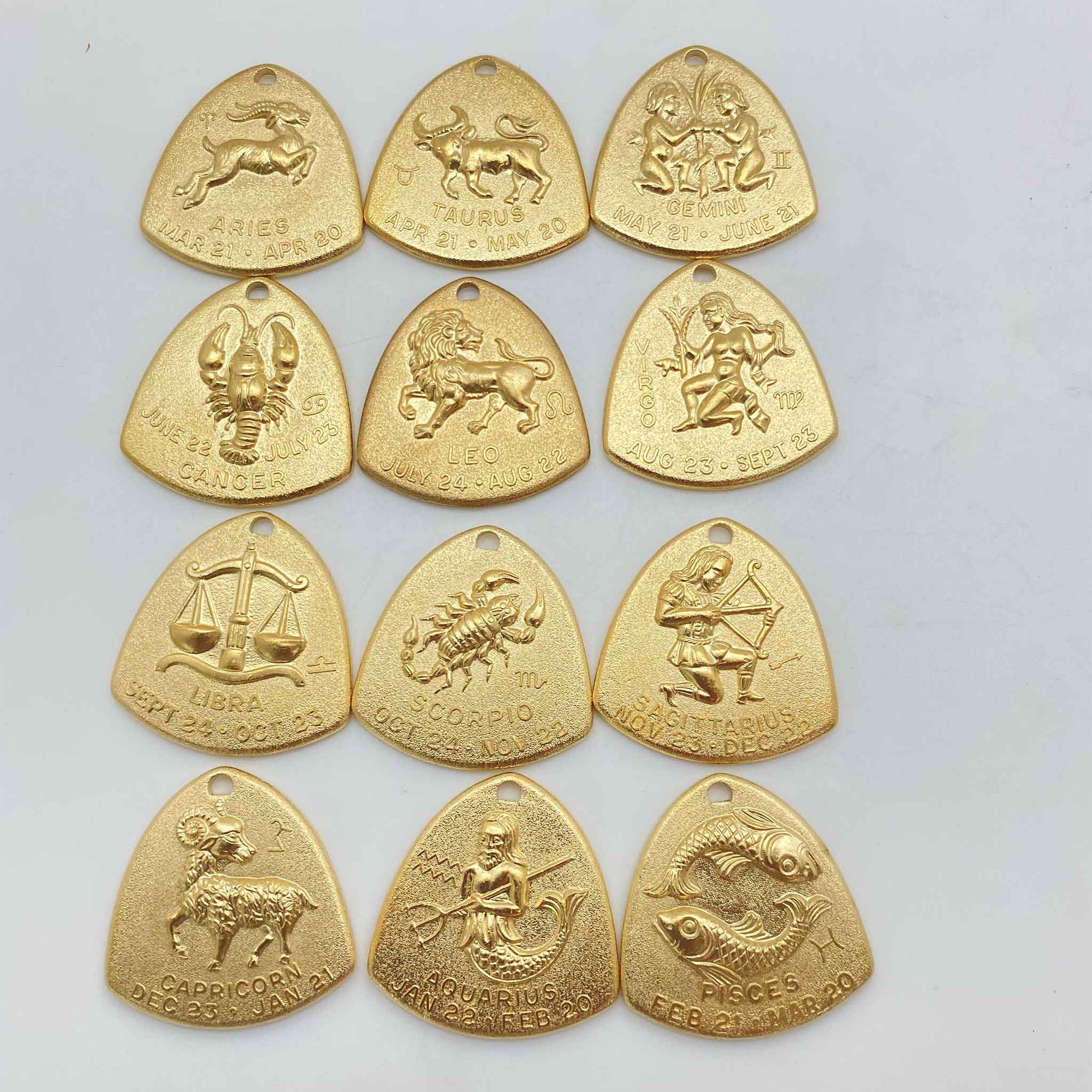 all 12 zodiac signs in vintage brass triangle zodiac charms